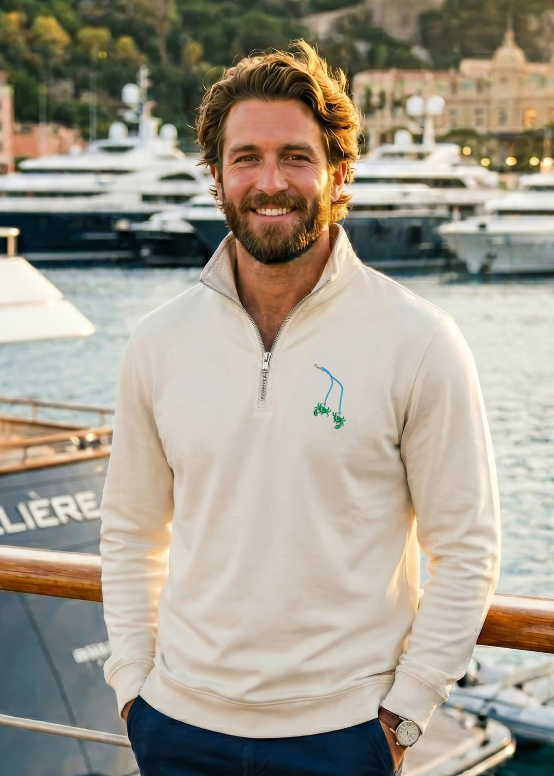 Man standing on a dock with yachts in the background