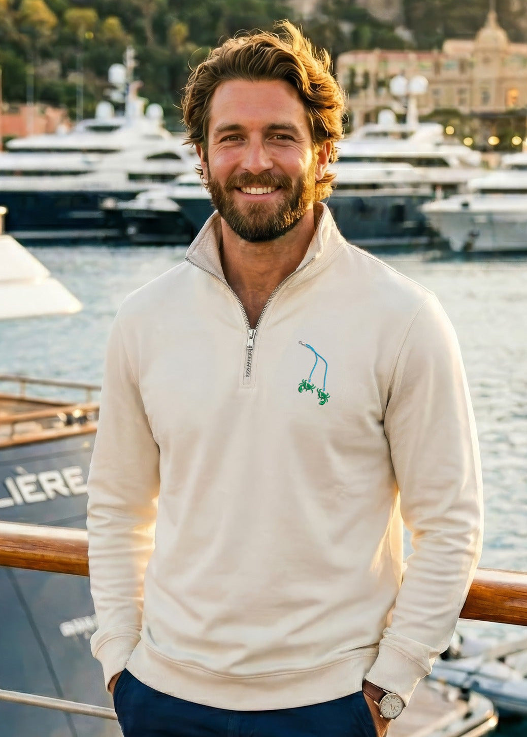 Man standing on a dock with yachts in the background